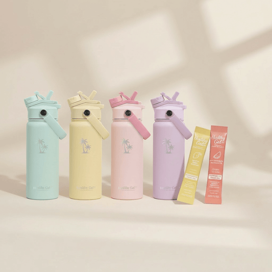 Four Healthy Gal™ Move Hydration Bottles in sage, butter yellow, blush pink, and lavender, displayed with Healthy Gal electrolyte stick packets