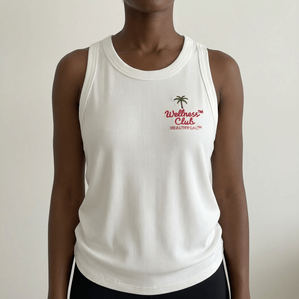 Front view of the Healthy Gal™ Wellness Club Tank in white ribbed fabric with embroidered palm tree and cursive logo on the chest, paired with black shorts
